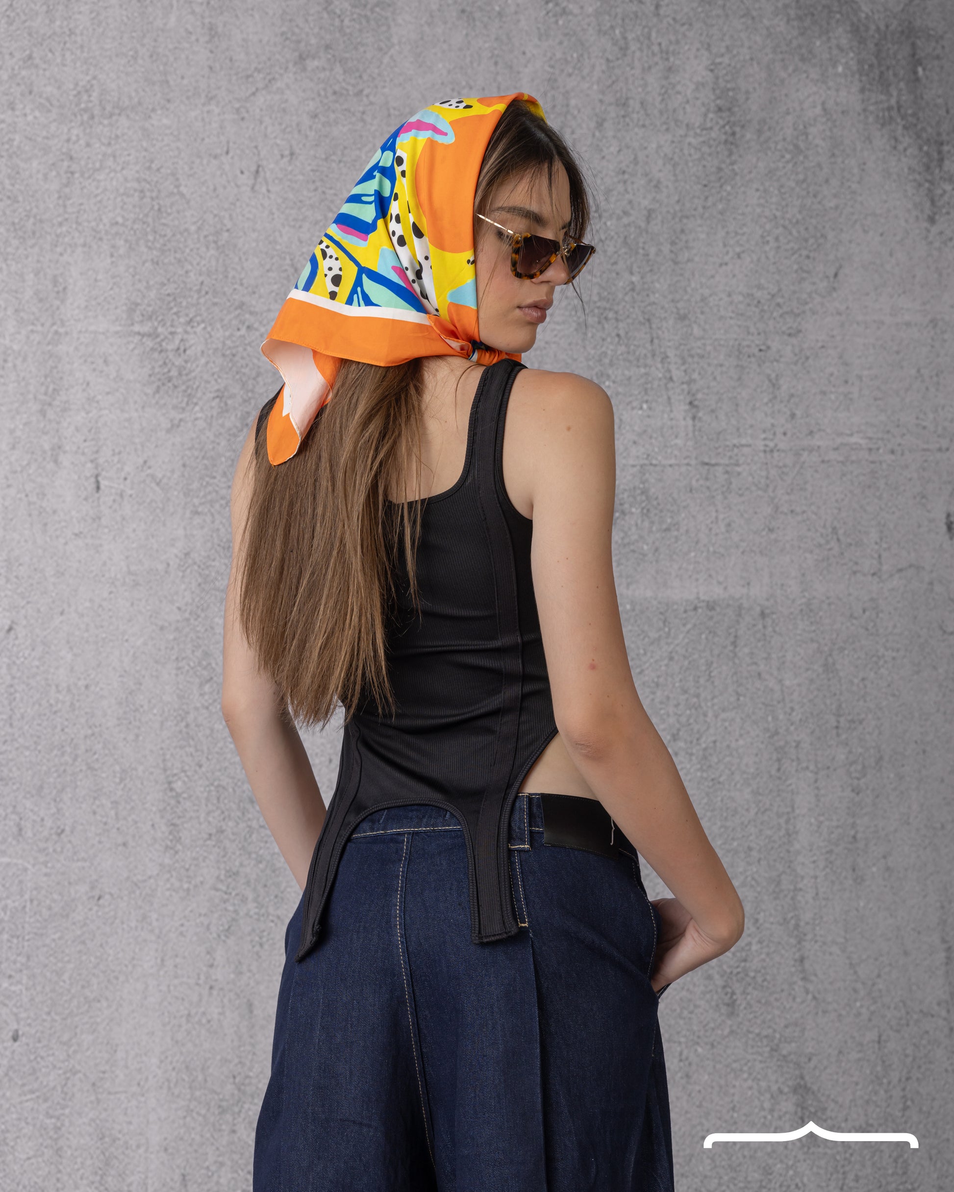 Asymmetrical hem tank top in Black