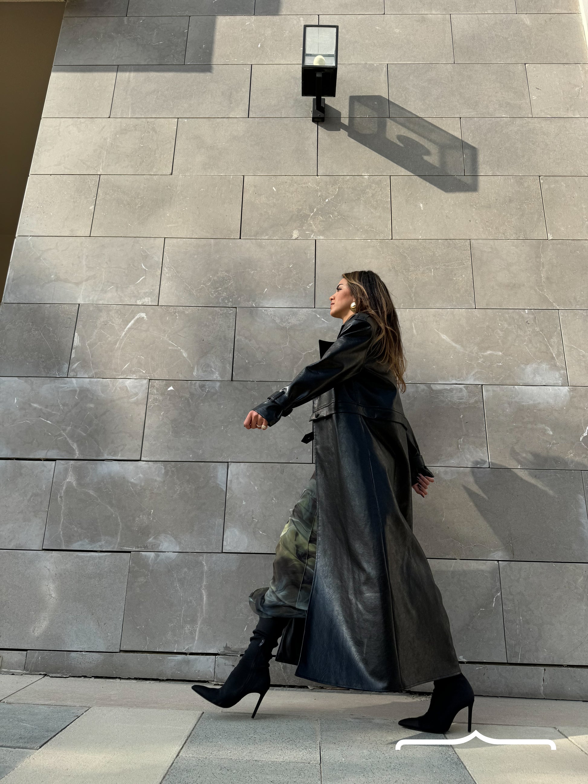 a women waring a leather coat 